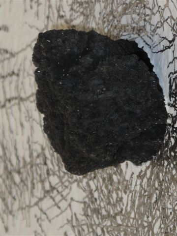 Click the image for a view of: Installation I detail. 2008. Graphite, lava rock